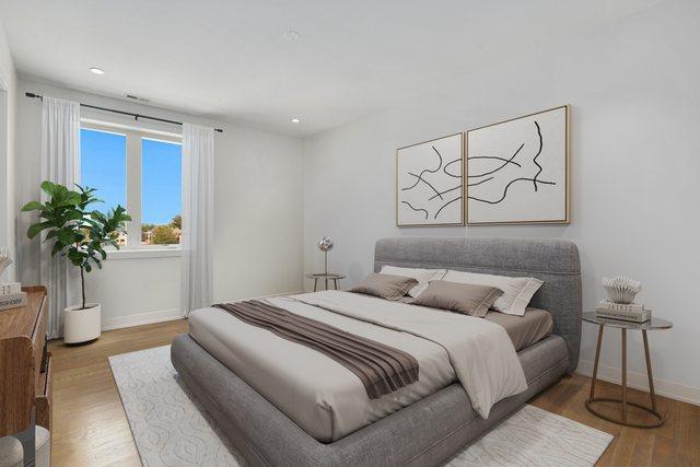 bedroom featuring baseboards, recessed lighting, and wood finished floors