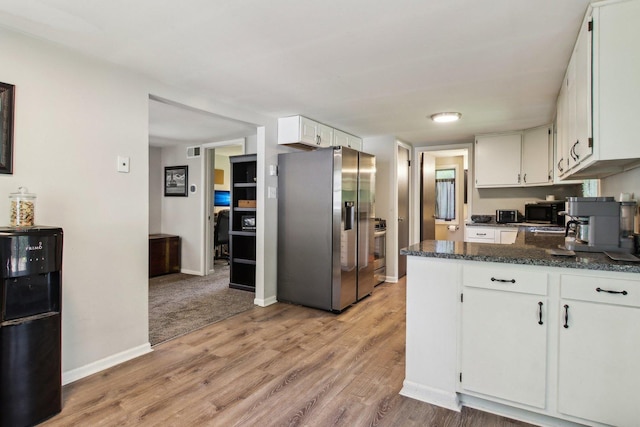 38622 N Drexel Blvd, Antioch, IL 60002 - kitchen with stainless steel appliances, white cabinetry, light wood finished floors, baseboards, and a peninsula