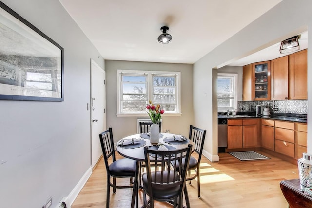4855 Dobson St Unit 304, Skokie, IL 60077 - dining space featuring baseboards and light wood-style flooring