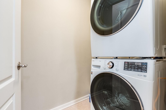 855 E 22nd St Unit 105, Lombard, IL 60148 - washroom featuring laundry area, stacked washer and clothes dryer, and baseboards