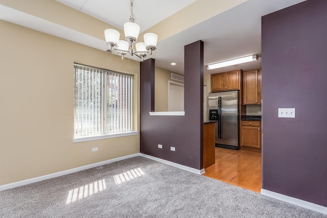 855 E 22nd St Unit 105, Lombard, IL 60148 - unfurnished dining area with light colored carpet, baseboards, a notable chandelier, and visible vents