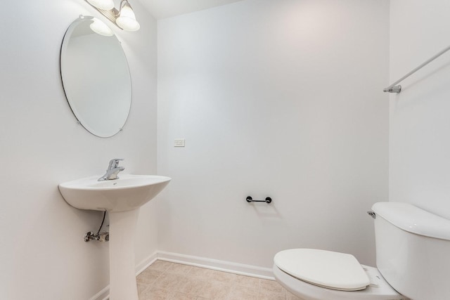 855 E 22nd St Unit 105, Lombard, IL 60148 - half bathroom featuring toilet and baseboards