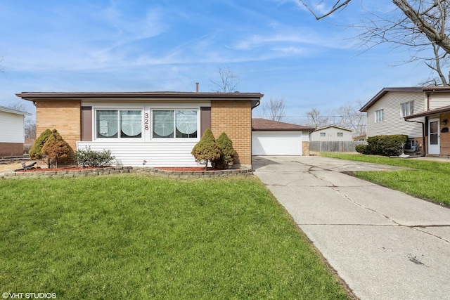 view of front facade featuring a garage, fence, a front yard, and brick siding