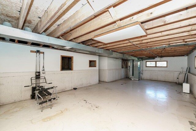 below grade area with a wainscoted wall