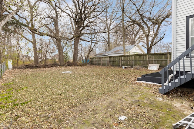 view of yard with a fenced backyard