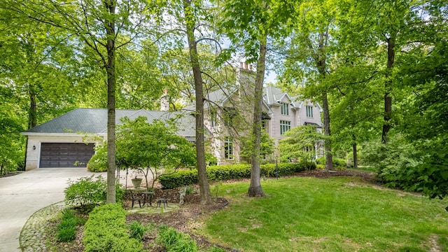 821 Chatfield Rd, New Lenox, IL 60451 - view of front of house with concrete driveway, a front yard, and a garage