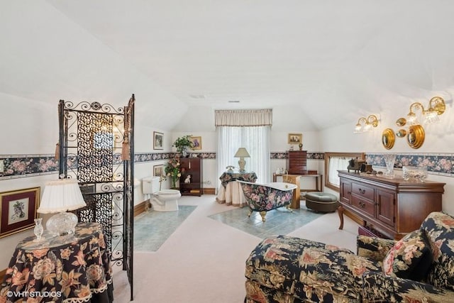 living area featuring carpet and vaulted ceiling