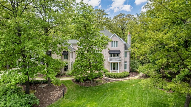 821 Chatfield Rd, New Lenox, IL 60451 - rear view of house featuring a lawn and a chimney
