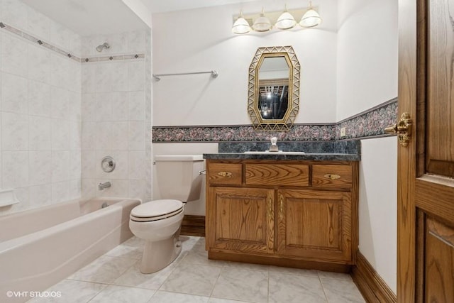 bathroom with shower / tub combination, toilet, and vanity