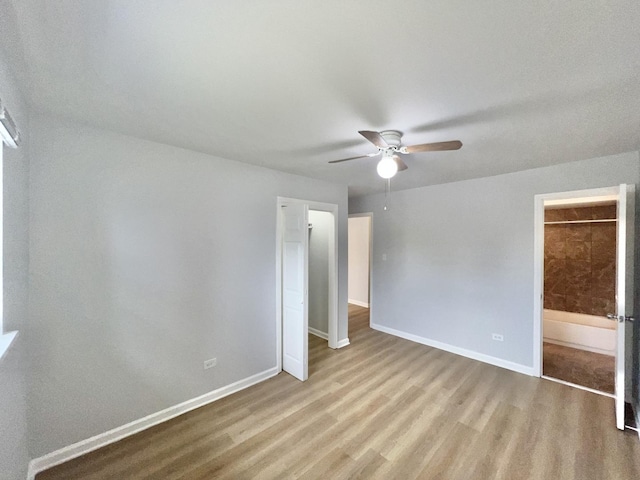 767 May St, Calumet City, IL 60409 - unfurnished bedroom featuring wood finished floors, baseboards, and a ceiling fan