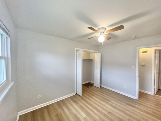767 May St, Calumet City, IL 60409 - unfurnished bedroom with baseboards, a closet, light wood-type flooring, and ceiling fan