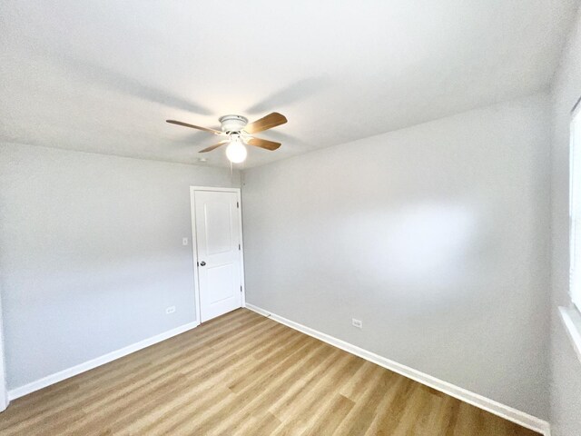 767 May St, Calumet City, IL 60409 - empty room with a ceiling fan, baseboards, and wood finished floors