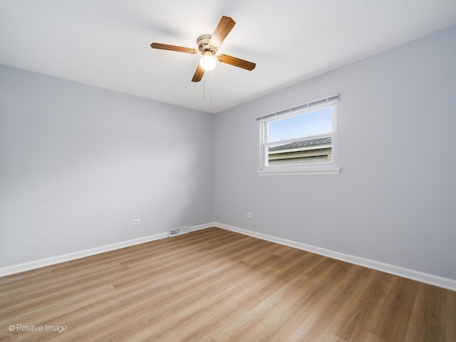 767 May St, Calumet City, IL 60409 - spare room with light wood finished floors, a ceiling fan, and baseboards