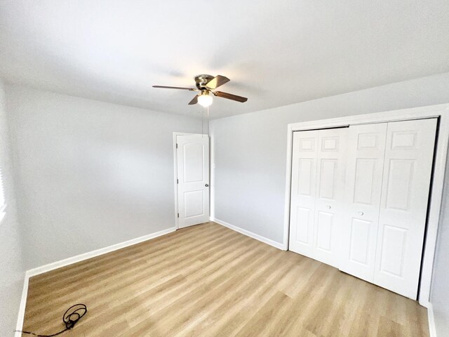767 May St, Calumet City, IL 60409 - unfurnished bedroom featuring baseboards, light wood-style flooring, a closet, and ceiling fan