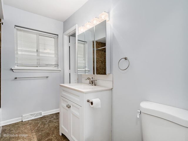 767 May St, Calumet City, IL 60409 - full bathroom with toilet, vanity, baseboards, and a shower