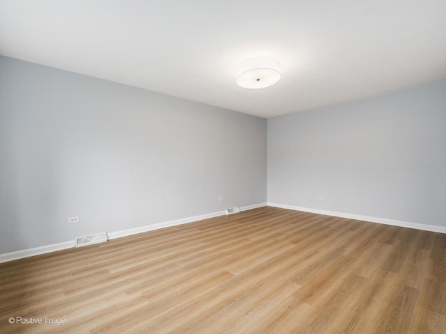 767 May St, Calumet City, IL 60409 - empty room with light wood finished floors and baseboards