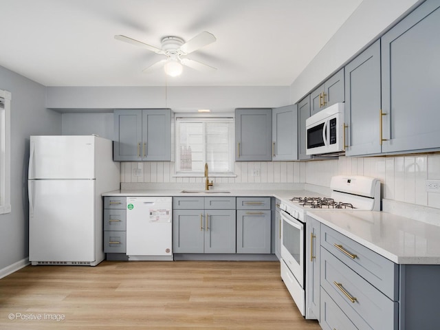 767 May St, Calumet City, IL 60409 - kitchen with white appliances, a sink, and gray cabinets