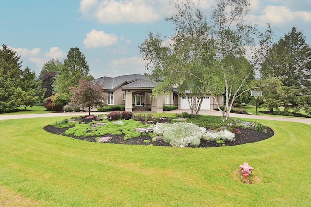 67 Katrina Ln, Sleepy Hollow, IL 60118 - view of front of property featuring curved driveway, a front yard, an attached garage, and stucco siding