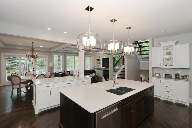 67 Katrina Ln, Sleepy Hollow, IL 60118 - kitchen featuring a chandelier, a sink, dishwasher, a center island with sink, and dark wood-type flooring