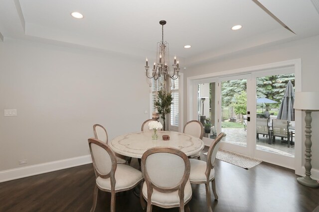 67 Katrina Ln, Sleepy Hollow, IL 60118 - dining area featuring dark wood-style flooring, a chandelier, recessed lighting, baseboards, and a raised ceiling