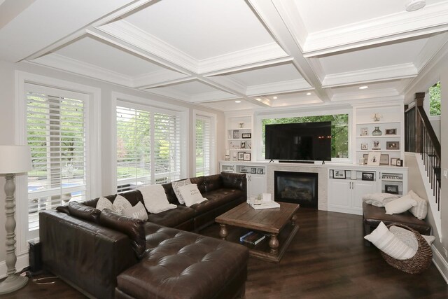 67 Katrina Ln, Sleepy Hollow, IL 60118 - living room with plenty of natural light, stairway, dark wood-style flooring, built in shelves, and crown molding