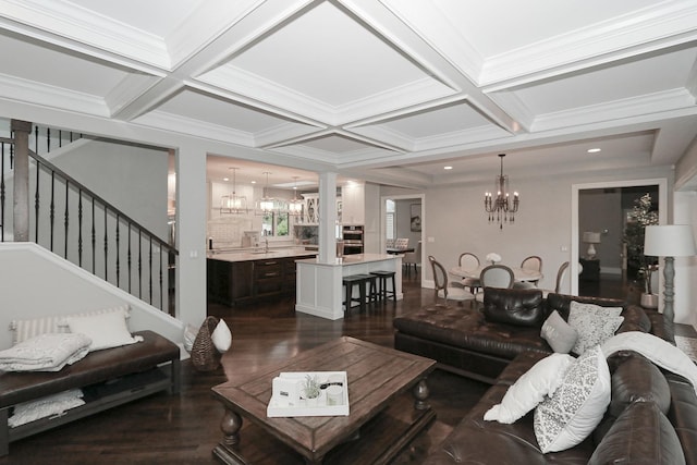 67 Katrina Ln, Sleepy Hollow, IL 60118 - living area featuring a chandelier, stairway, dark wood-style flooring, coffered ceiling, and ornate columns