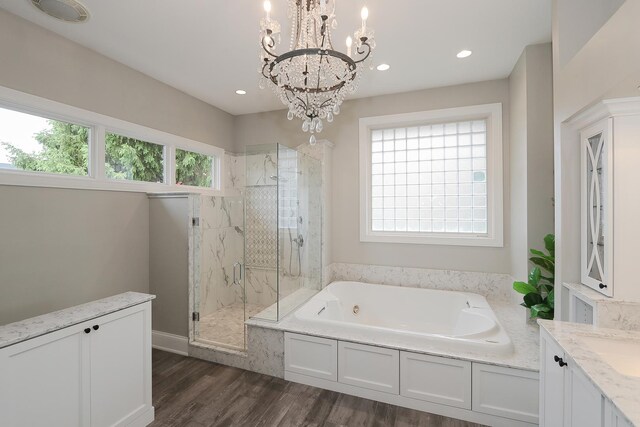 67 Katrina Ln, Sleepy Hollow, IL 60118 - bathroom featuring a marble finish shower, a whirlpool tub, wood finished floors, a chandelier, and recessed lighting