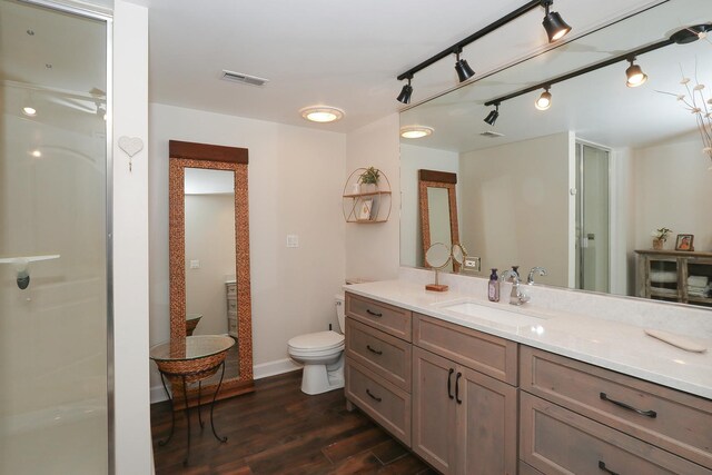 67 Katrina Ln, Sleepy Hollow, IL 60118 - bathroom featuring wood finished floors, a shower stall, vanity, toilet, and baseboards