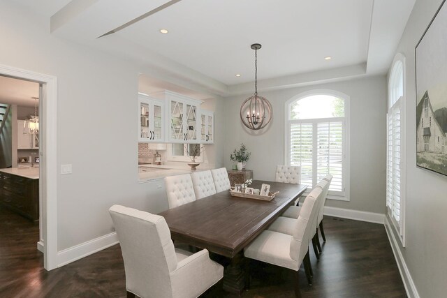 67 Katrina Ln, Sleepy Hollow, IL 60118 - dining area with a chandelier, a tray ceiling, dark wood-style flooring, baseboards, and recessed lighting