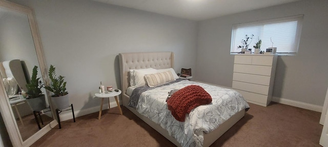 carpeted bedroom featuring baseboards