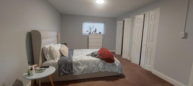 carpeted bedroom featuring baseboards