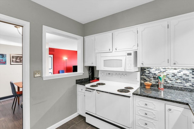 kitchen with white appliances, white cabinetry, tasteful backsplash, and baseboards