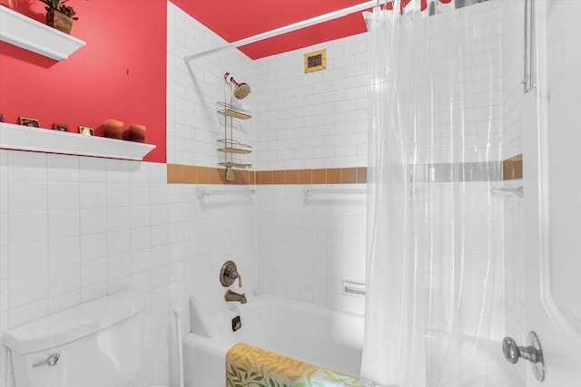 full bath featuring toilet, shower / bath combination with curtain, and tile walls