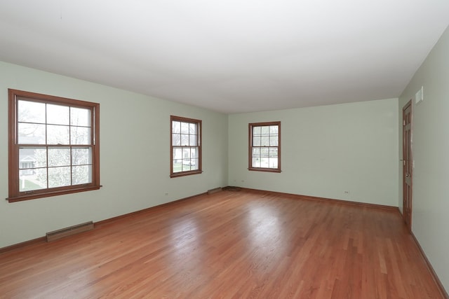 202 Heath Ct, Barrington, IL 60010 - unfurnished room featuring baseboards, visible vents, and light wood-style flooring
