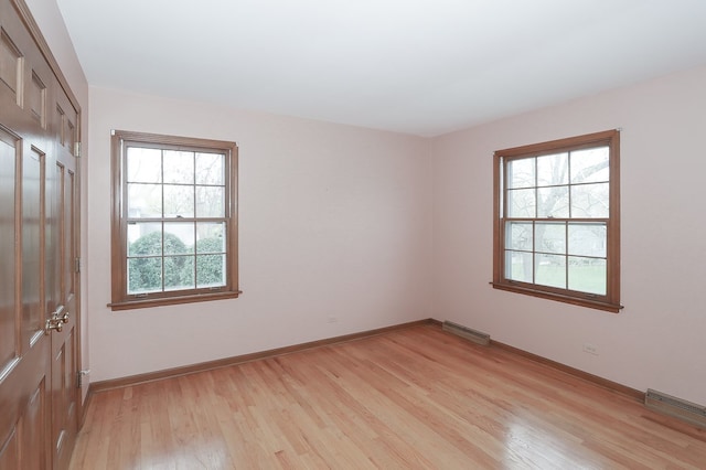 202 Heath Ct, Barrington, IL 60010 - unfurnished room with baseboards, visible vents, and light wood-type flooring