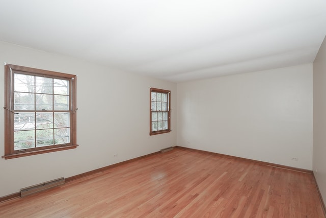 202 Heath Ct, Barrington, IL 60010 - spare room with baseboards, visible vents, and light wood-style flooring