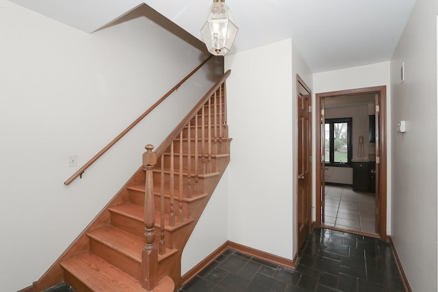 202 Heath Ct, Barrington, IL 60010 - staircase featuring baseboards and a chandelier