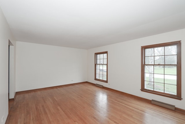 202 Heath Ct, Barrington, IL 60010 - unfurnished room with visible vents, a healthy amount of sunlight, and light wood-style floors