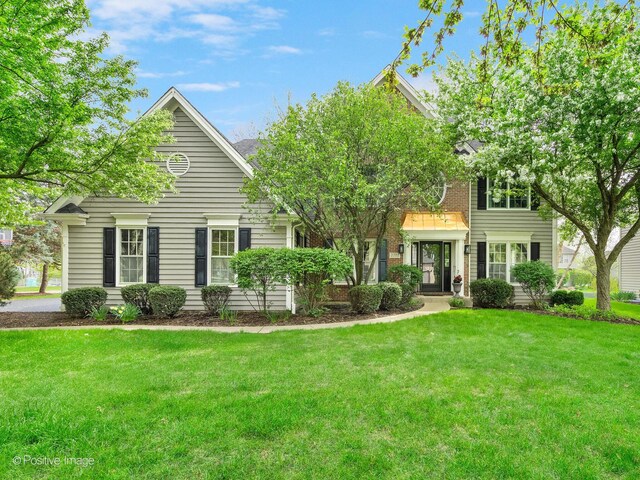 1301 Hawkins Ct, Saint Charles, IL 60174 - view of front facade featuring a front lawn and brick siding