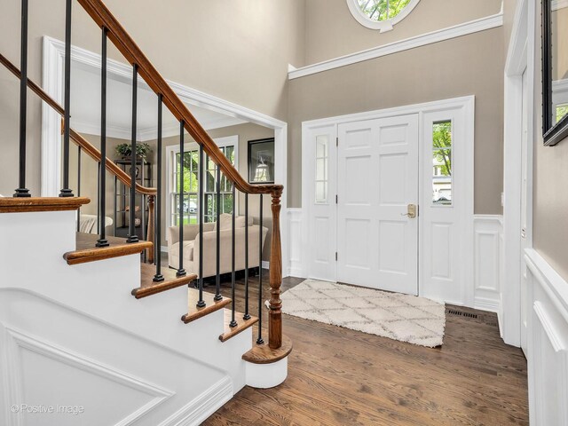 1301 Hawkins Ct, Saint Charles, IL 60174 - entrance foyer featuring a decorative wall, wood finished floors, wainscoting, and a healthy amount of sunlight