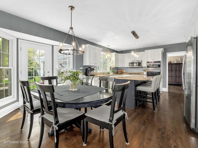 1301 Hawkins Ct, Saint Charles, IL 60174 - dining room featuring baseboards, a healthy amount of sunlight, and an inviting chandelier