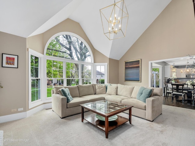 1301 Hawkins Ct, Saint Charles, IL 60174 - living area featuring baseboards, a notable chandelier, and high vaulted ceiling