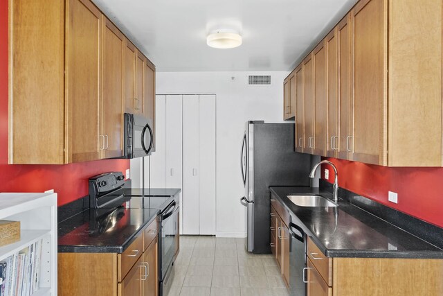 400 E Ohio St Unit 3203, Chicago, IL 60611 - kitchen featuring brown cabinets, a sink, light tile patterned floors, visible vents, and black appliances