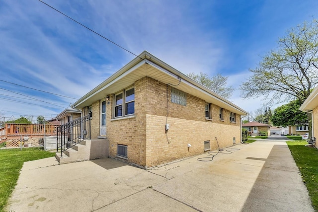 view of property exterior featuring brick siding