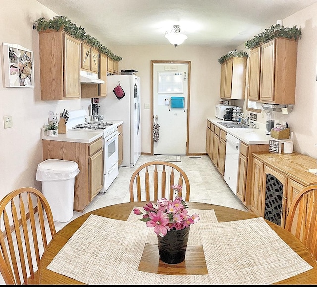 753 Golden Prairie Dr, Davis Junction, IL 61020 - kitchen featuring white appliances, under cabinet range hood, and light countertops