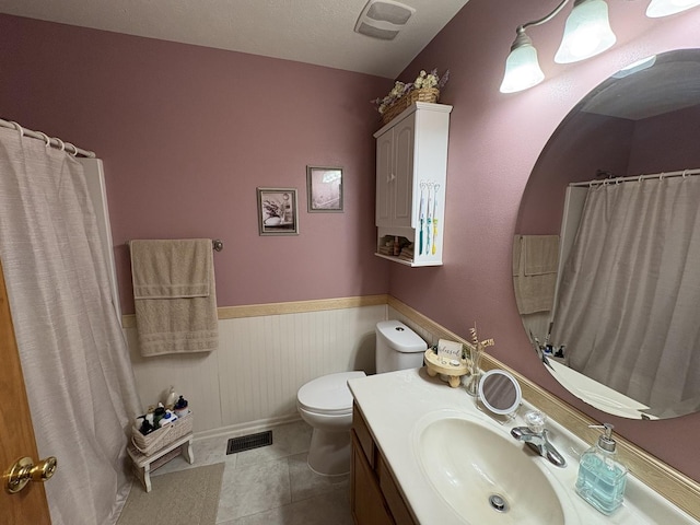 753 Golden Prairie Dr, Davis Junction, IL 61020 - bathroom featuring vanity, a wainscoted wall, a shower with shower curtain, and tile patterned floors