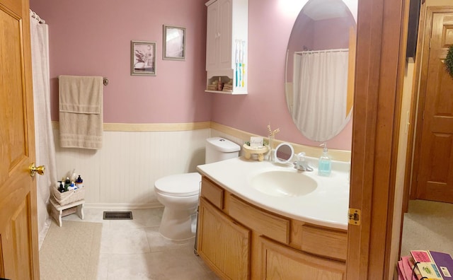 753 Golden Prairie Dr, Davis Junction, IL 61020 - bathroom featuring vanity, wainscoting, tile patterned flooring, and curtained shower