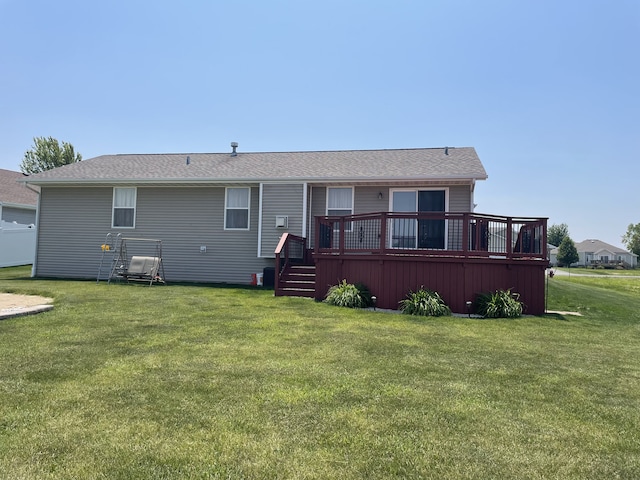 753 Golden Prairie Dr, Davis Junction, IL 61020 - rear view of house with a wooden deck and a yard