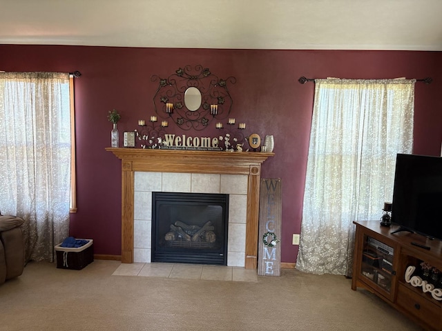 753 Golden Prairie Dr, Davis Junction, IL 61020 - carpeted living room featuring a tile fireplace and baseboards
