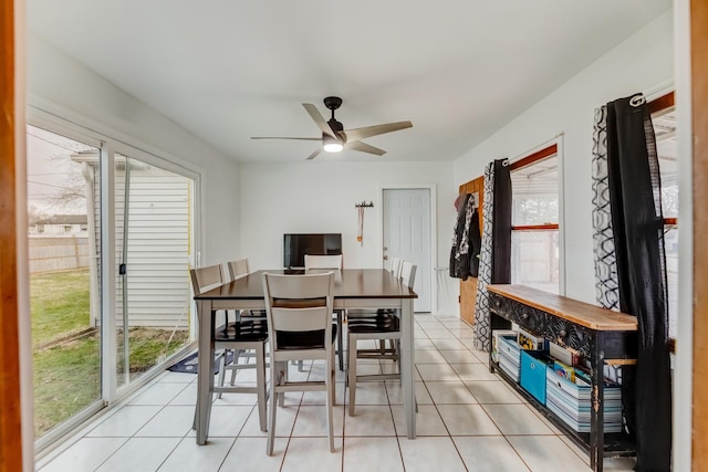 dining room with light tile patterned floors and ceiling fan